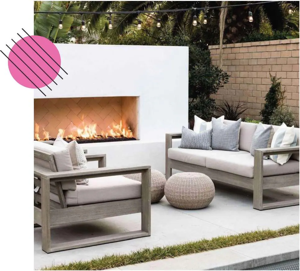Modern backyard patio with outdoor fireplace and lounge seating