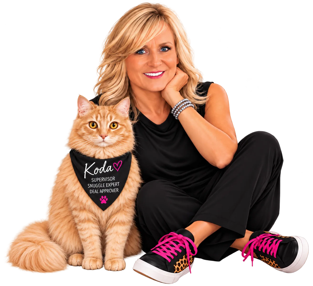 Deah Hendriksz, an Arizona Realtor with Realty ONE Group, smiling and sitting beside her orange cat Koda, who wears a black bandana that reads Supervisor, Snuggle Expert, Deal Approver